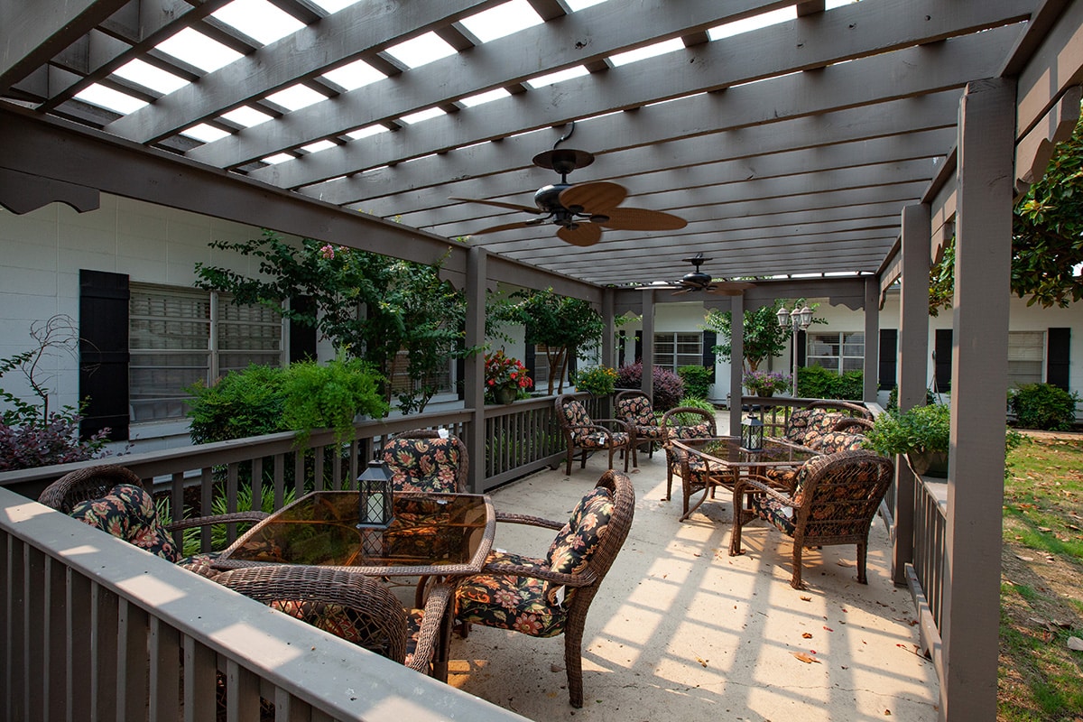 A patio with tables and chairs at Haywood Post Acute